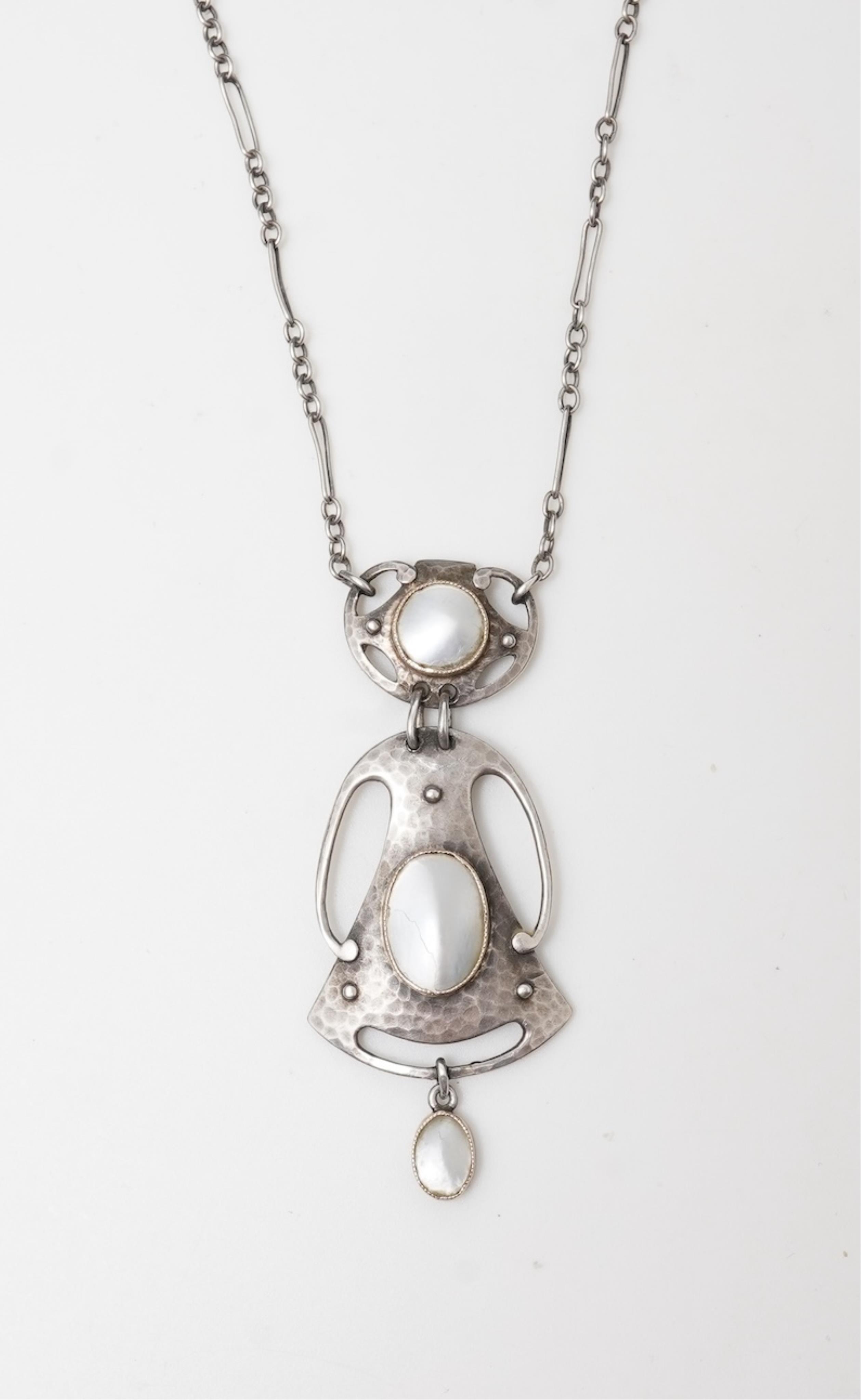 Murrle, Bennett & Co., an Arts & Crafts silver and mother of pearl pendant, circa 1900